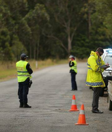 NSW Police stop and question motorists at a checkpoint on the outskirts of Kendall. Photo: Kate Geraghty