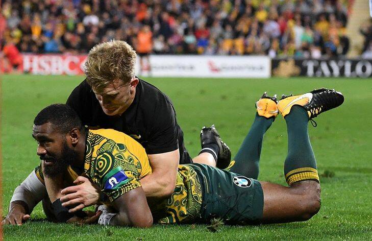 Marika Koroibete of the Wallabies scores a try during the Rugby Championship, Bledisloe Cup match between the Australian Wallabies and the New Zealand All Blacks at Suncorp Stadium in Brisbane, Saturday, October 21, 2017. (AAP Image/Dave Hunt) NO ARCHIVING