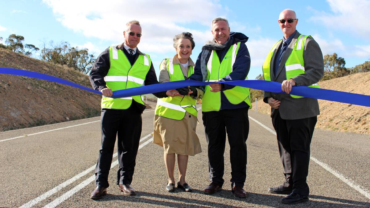 Upper Lachlan Mayor John Shaw, Member for Goulburn Pru Goward, NSW Roads Minister Duncan Gay and Upper Lachlan General Manager John Bell cut the ribbon on MR 248 East on Tuesday morning. 