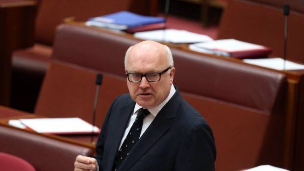 Attorney-General George Brandis praised the new internet monitoring laws being passed. Photo: Andrew Meares