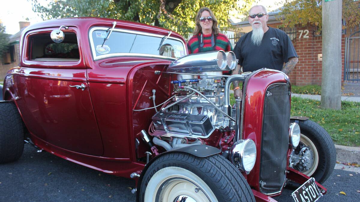 WELL-TRAVELLED: Tony and Karen Kean from Boddington, Western Australia
pose with their 1932 Ford Coupe.