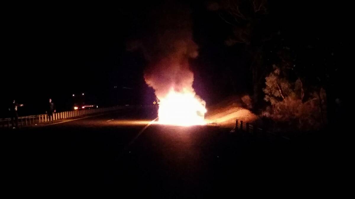 UP IN FLAMES: A man fortunately escaped this car fire on the Hume Highway near Carrick last night. Photo: Aoife Champion. 