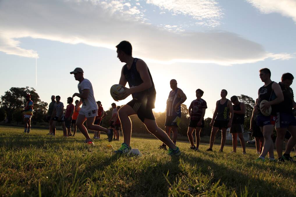 TRAINING TIME: Men and women from the Gunning Kangaroos rugby league club swelter under the hot Thursday sun during their first training session of the year. Photo: Peter Oliver. 