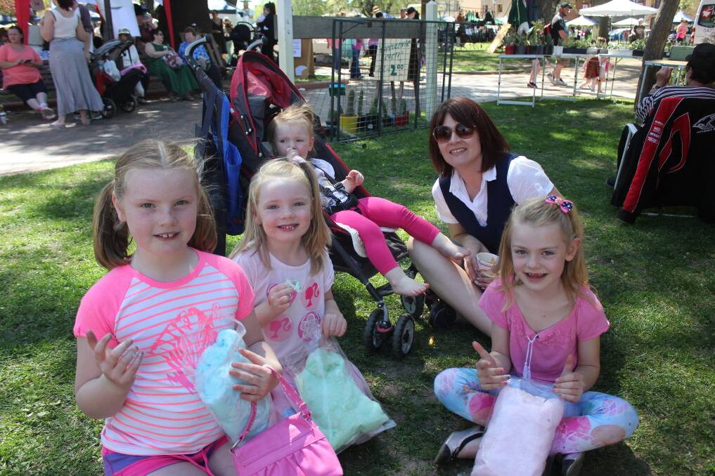 FAMILY OCCASION: Local mum Julie Burton enjoyed soaking up the sun with some fairy floss with her daughters (from left to right) Talia Hayes (7), Gracie Hayes (5), Charli Hayes (6) and Holly Hayes (1, in stroller).