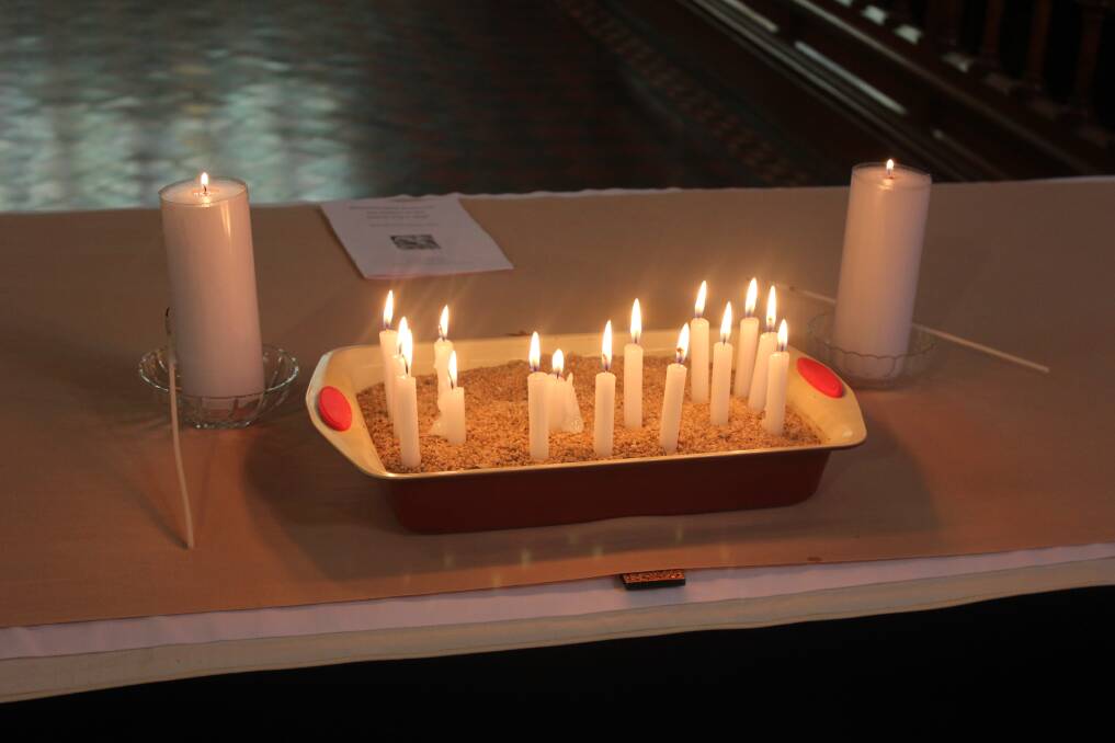 SHINE BRIGHT: A series of candles lay on the altar of St Saviours Cathedral after the Ecumenical service was held to remember those involved in the siege.