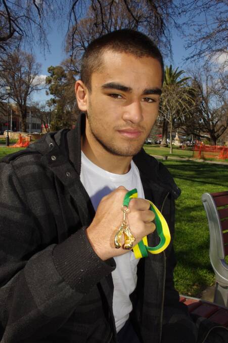 BOXING CHAMPION: New Goulburn resident Damien Vaughan, 16, with his Golden Gloves medallion.