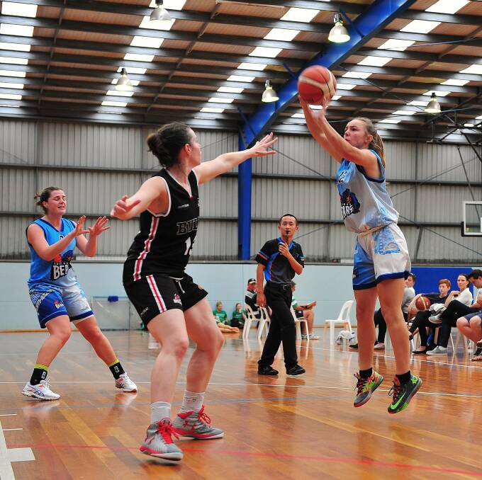 ACTION: Goulburn Bears player Ellie Hazelton in action against an Inner West Bulls player at the Minto Basketball Stadium on Saturday. (Photo: Noel Rowsell)