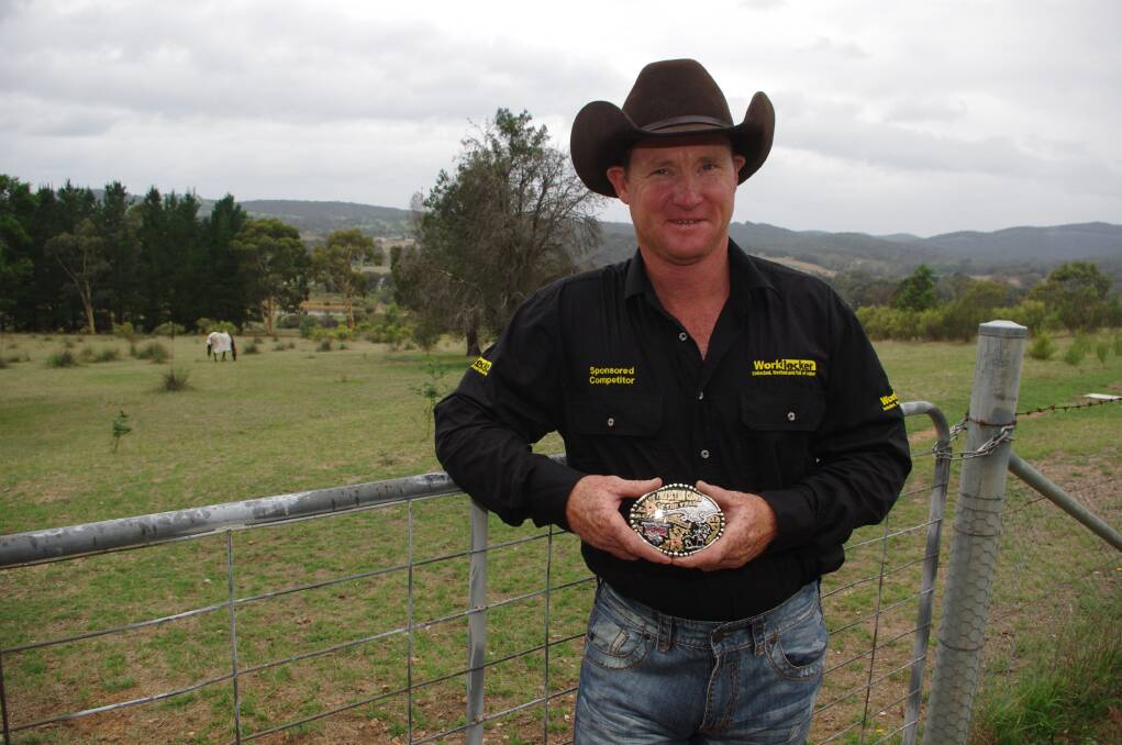 TOP CLOWN: Warren Norton relaxing at home on his Towrang property with his 2015 ABCRA Protection Clown of the Year Buckle. Photo: Darryl Fernance.