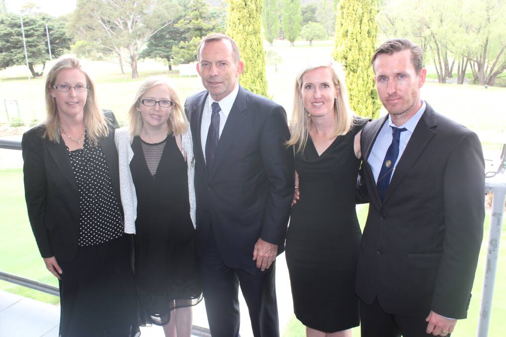 HONOURED: Former Prime Minister Tony Abbott visited Goulburn to attend the funeral and wake for former Goulburn City Council engineer and administrator Peter Mowle on Wednesday. He is pictured here at the wake at Goulburn Golf Club with Mr Mowle’s children Stephanie (left), Sheridan, Melissa and Nicholas Mowle.