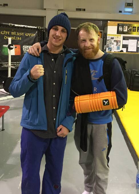 RIENDLY FIGHTERS: Goulburn MMA fighter Joel Downey-Cave with Ultimate Fighting Championships (UFC) fighter Paddy Holohan in Straight Blast Gym Ireland. Photo: Henry Osborne.
