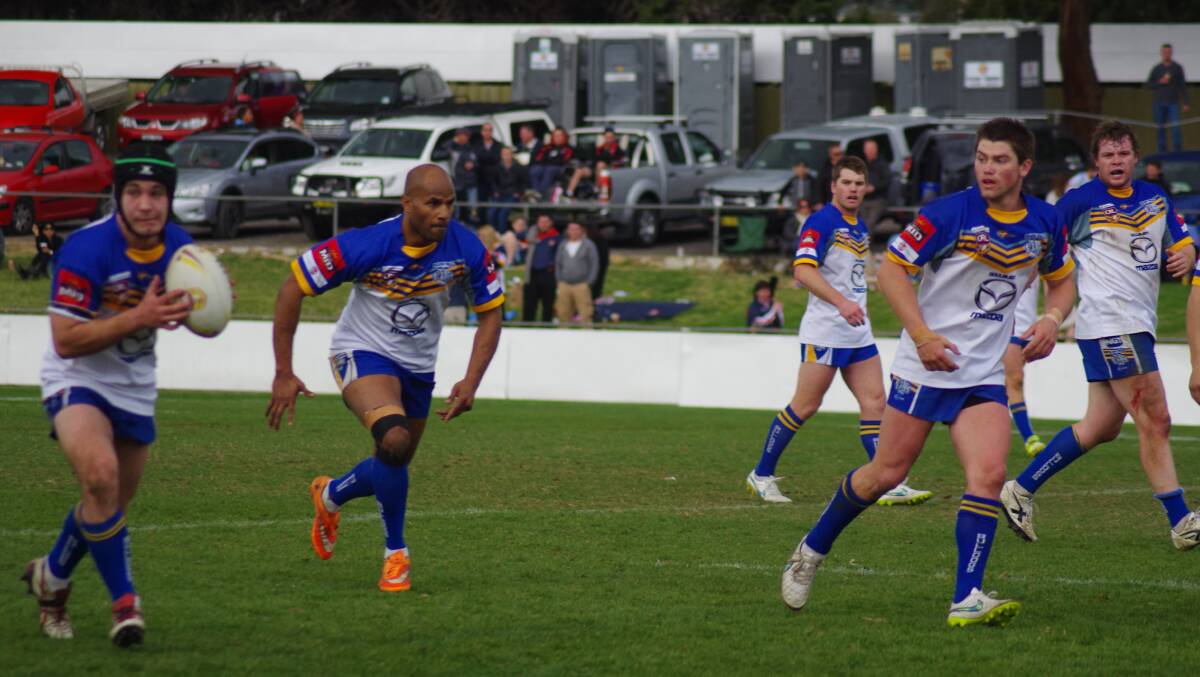 NEVER SAY DIE: Goulburn Workers Bulldogs take the ball up field during their grand final clash with Queanbeyan Blues on September 6, 2015. Photo by Darryl Fernance.
