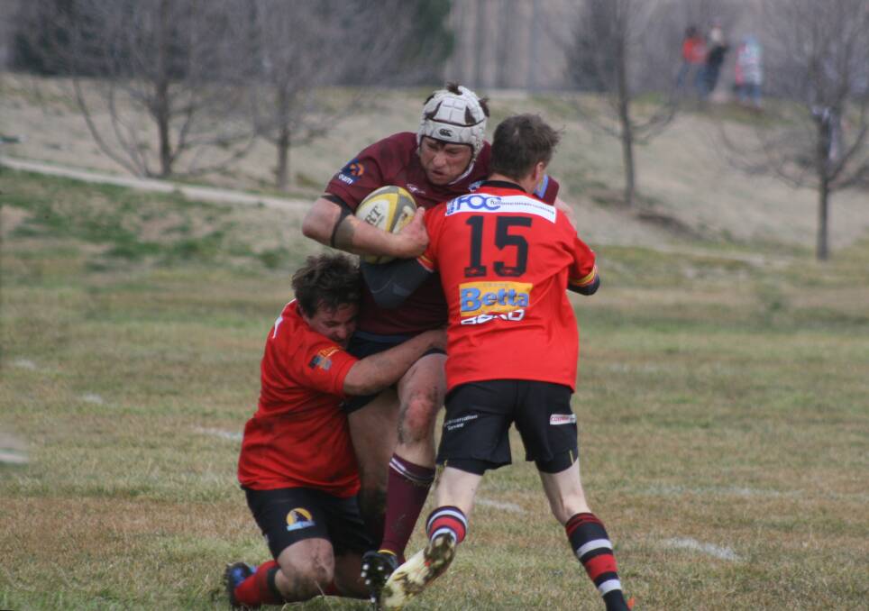 CHARGING THROUGH: Goulburn Dirty Reds’ captain coach Boyd Newby breaks through the Cooma defence in the Reds First Grade 57 to 17 win on Saturday. Photo by Chris Gordon.