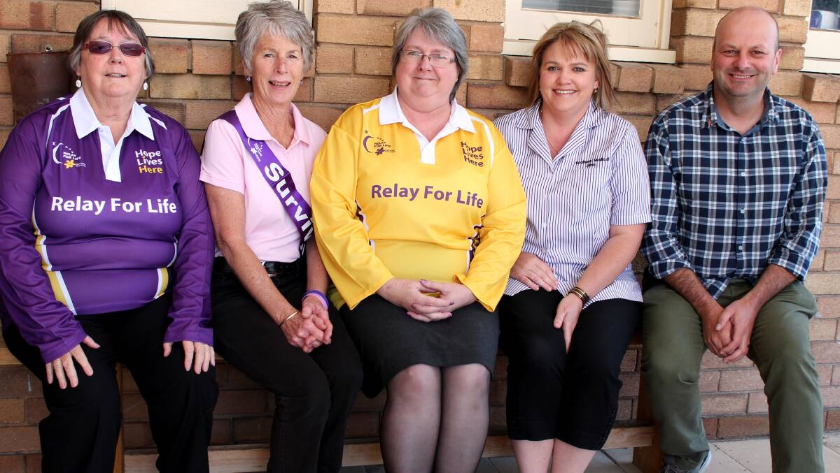 TOGETHER: Four members of team Rosie’s Buds on Tuesday Trish Rosevear, Lynn Hornbrook, Rosie Curtis and Paula St Vincent with Cancer Council Community Relations Coordinator Craig Norris.