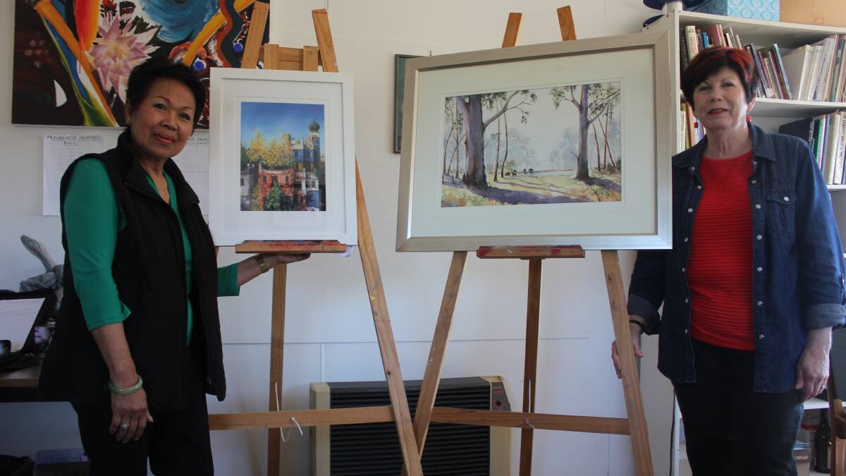 AWARD WINNING: Goulburn and District Art Society president Helen De Jonge (right) and committee member Aina Atkins show off their submissions in readiness for the annual Workers Club Annual Art Prize, to be held this weekend in the Workers Club Auditorium 