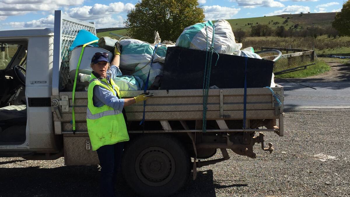 BUSY: Sue Leahy (pictured) and Ruth Gibson collected more than 260kg
of rubbish along a stretch of Braidwood Rd at Tirrannaville.