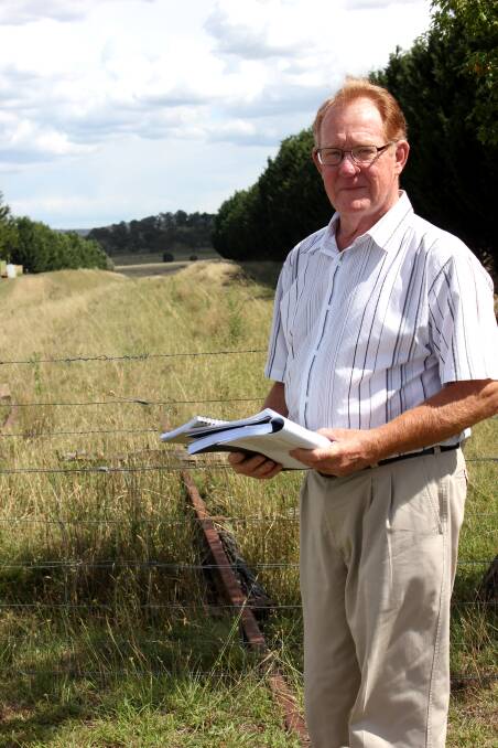 Deputy Mayor Bob Kirk stands on part of the abandoned Goulburn to Crookwell rail line, in Campbells Lane.
