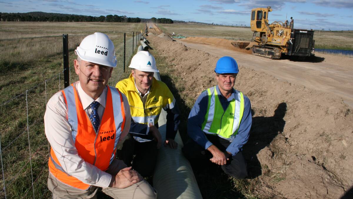 NOT EASY: Mayor Geoff Kettle, HSP consultant Christian Leah and then Goulburn Mulwaree Council engineering services director Terry Cooper watched the progress of Highland Source through Marulan district property, ‘Lockyersleigh’ in 2011.
