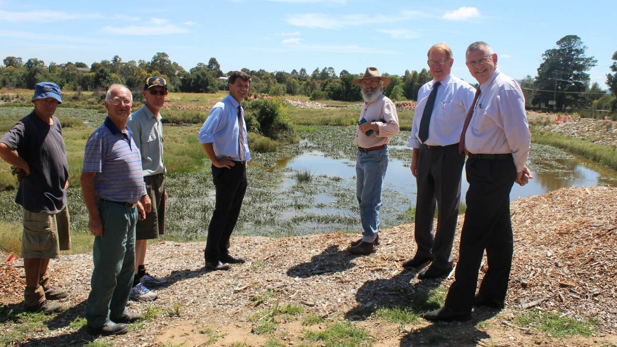 ECO BOOST: Angus Taylor, Mayor Geoff Kettle and
Deputy Mayor Bob Kirk at the Goulburn Wetlands
site with FROGS representatives Alex Fry, President
Ray Shiel, Secretary Peter Mowle and Executive
Member Rodney Falconer.