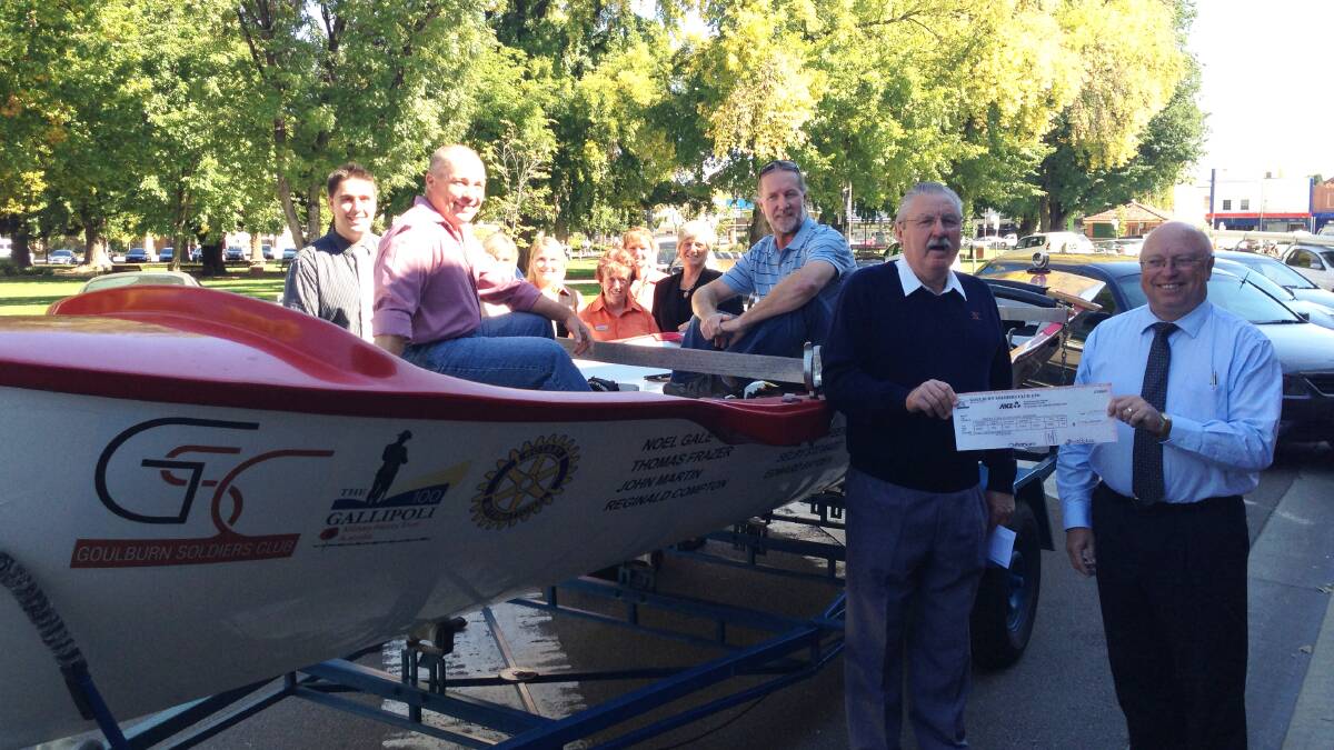 
 Club president Mick Donnelly presented a cheque for $21,000 to Rotarian Graeme Hewitt on Friday, while two members of the Gallipoli 100 surfboat crew from Goulburn, Peter Greaves, Andrew Woolner and Soldiers Club general manager Toni Mitchell and her staff, look on. The Soldiers Club is one of the major sponsors of the event.
