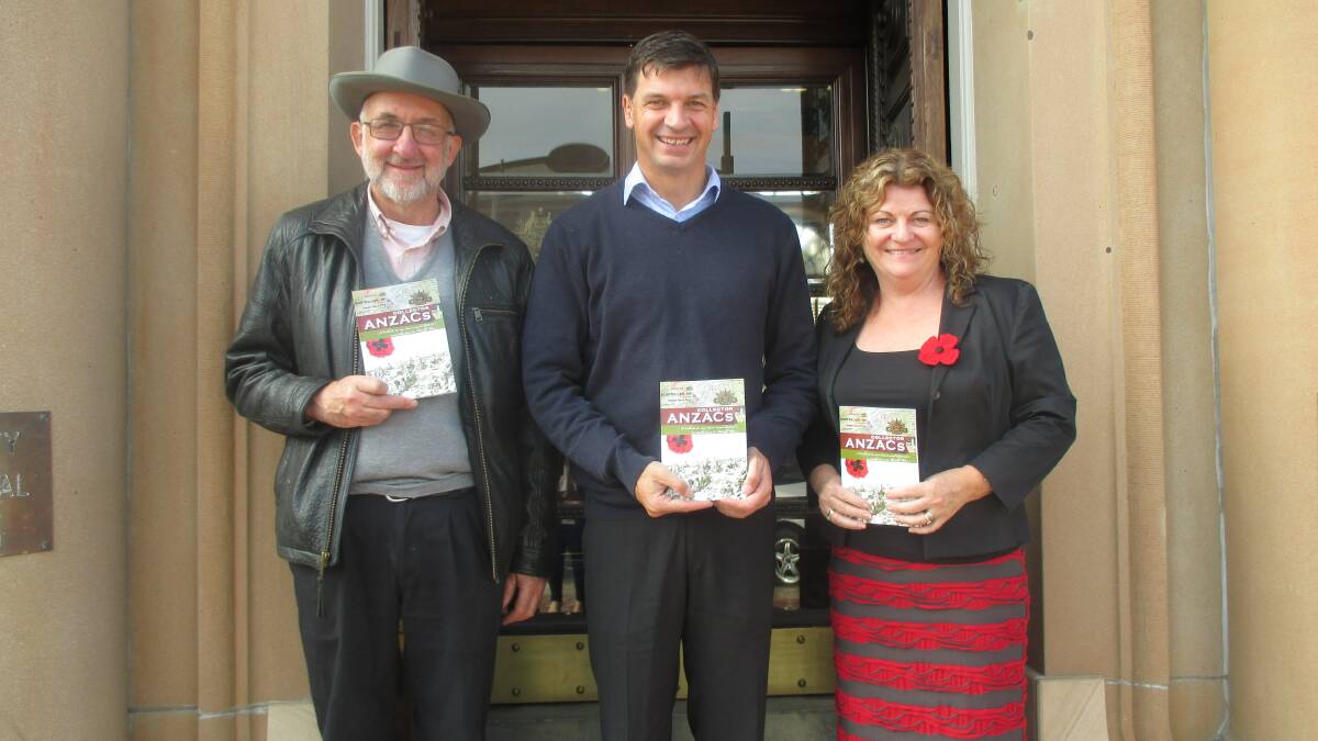  HISTORIC: President of the Collector and District Historical Association, Ann Hegyi (right) and CDHA member/ chief researcher, Frank Ross (left), took three copies of the Collector Anzacs book to show Federal Member for Hume Angus Taylor recently.
