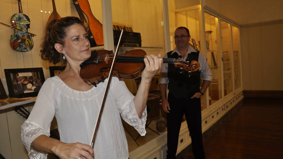COUP: Sydney Symphony Orchestra violinist Kirsten Williams has joined Goulburn’s Regional Conservatorium as patrons of its strings program delivered to young school students. Director Paul Scott- Williams (background) is chuffed to have his friend involved.
