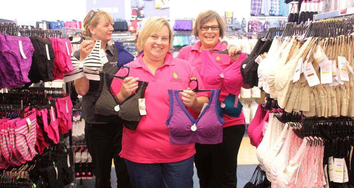 Young Hope’s Kathy Staines (centre) and Mel Byrne (right) with Best & Less Goulburn store manager Raylene Lockett with the bras on Monday.