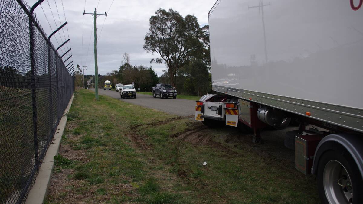 JACK-KNIFED: A B-double got bogged in the Ducks Lane soft verge, blocking traffic in and out of Run-O-Waters for two hours yesterday. Photo: Darryl Fernance