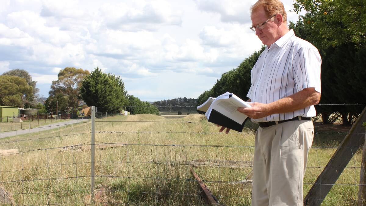 Deputy Mayor Bob Kirk stands on part of the abandoned Goulburn to Crookwell rail line, in Campbells Lane.