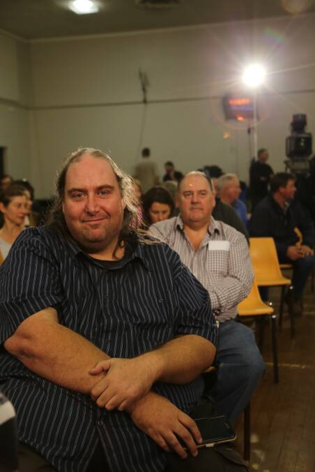 Goulburn resident Mark McColl was selected to question the three panelists on closing the gap between regional and metro areas. Photos: Brittany Murphy