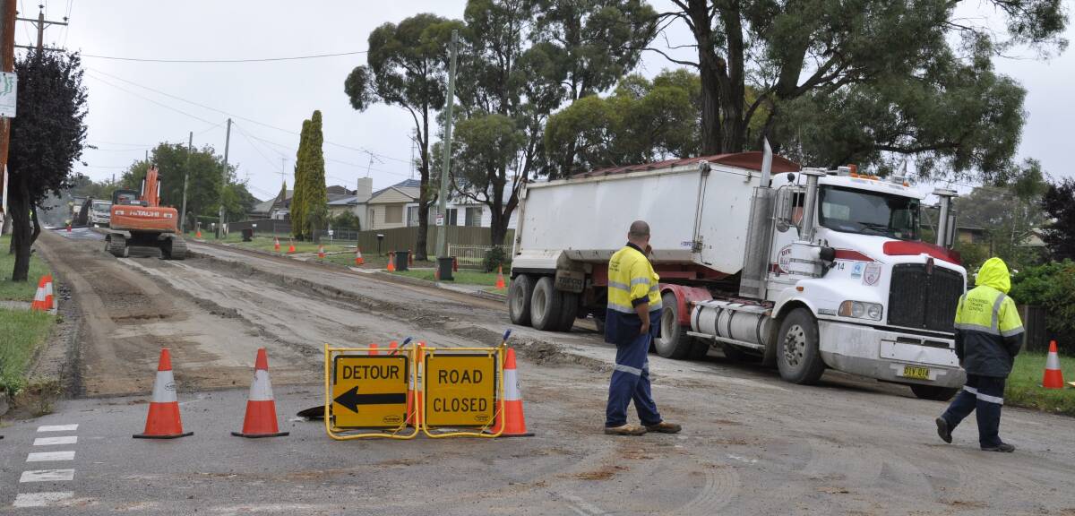 NO GO: A crew was hard at work upgrading a 300-metre section of Taralga Rd yesterday.
