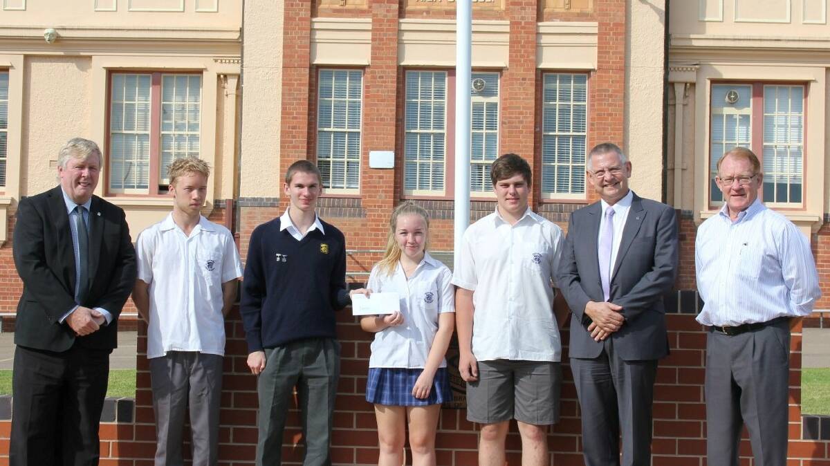 READY: Mayor Geoff Kettle and Deputy Mayor Cr Bob Kirk recently donated a cheque for $5000 to Goulburn High School students Emmot Falconer, Will Hargan, Joe Muscarella, and Ashley Hind. The students will travel to the U.S. on April 12 to compete in the VEX Robotic World Championships in Louisville, Kentucky from April 15-18. They are pictured with Goulburn High School principal Peter Browne (left).
