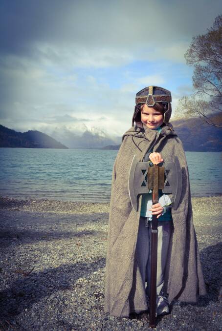 DWARFED: Georgie Jubb stepped into character as Gimli the dwarf, with
the Remarkables behind her, as the family toured The Hobbit and Lord of
the Rings filming locations.