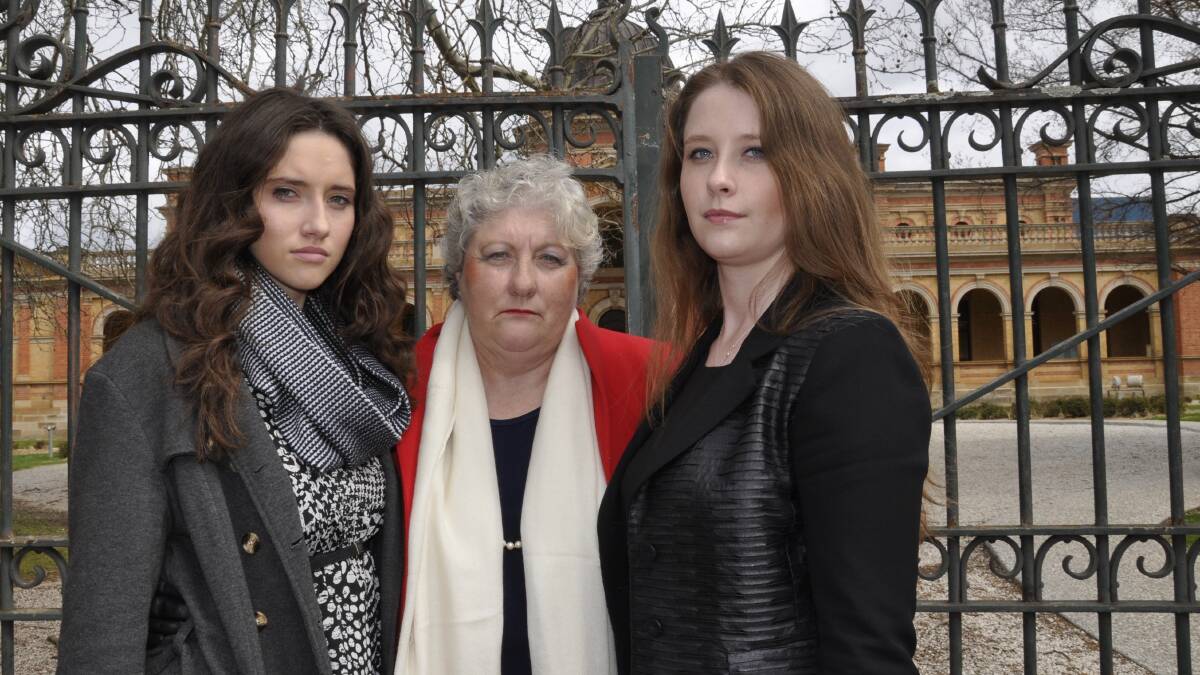 GRIEVING: Dr Catherine Brassill and daughters Felicity and Elizabeth paid a loving tribute to their husband and father, Andrew Ahern, on the final day of an inquest into his death 