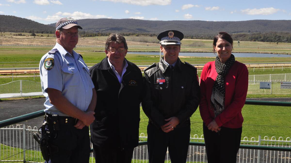 PARTNERSHIP: Senior Constable Phillip Anderson, Goulburn and District
Horse Racing Club secretary Greg Wilson, Detective Inspector Chad Gillies
and Robyn Fife. Photo: Chris Clarke.
