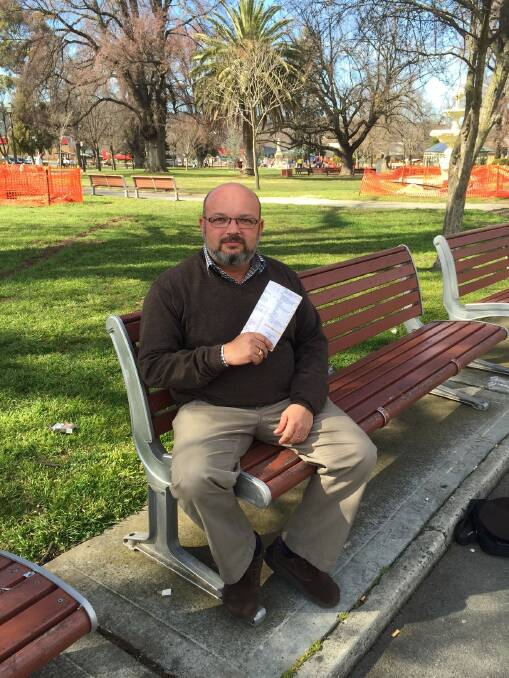 MEMOIR: Local writer Phillip Stamatellis’ first book - Growing Up Cafe - in Belmore Park recently.
