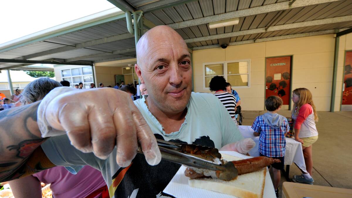 Ian Cooper was cooking the barbecue at Ballarat North Primary School. PIC: JEREMY BANNISTER 