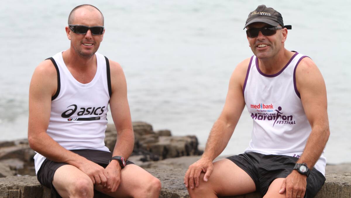 Shane Taylor (left) and Tim Blair go over the course of action for their Bluff to Bondi fund-raising run. Picture: Katrina Dodd.
