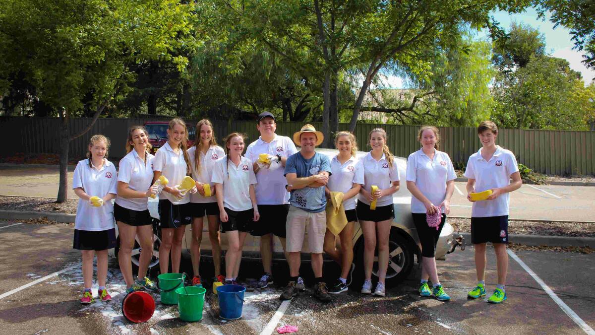 SELFLESS: Trinity Catholic College students going to Timor Leste are washing cars as well as other fundraisers for the communities they will visit, and want your support. Photo: Jesse Price