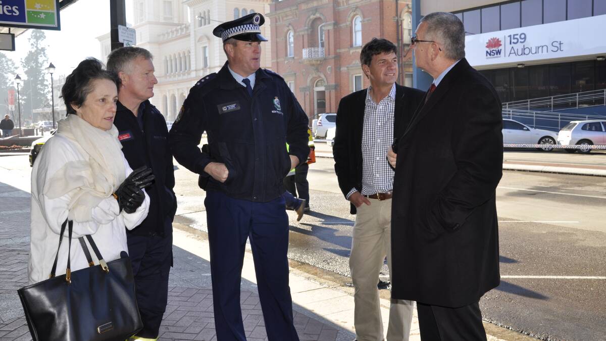 Goulburn MP Pru Goward, Area Commander for Fire and Rescue NSW Ken Murphy, Detective Inspector Matt Woods, Hume MP Angus Taylor and mayor Geoff Kettle discuss the fallout from last night’s fire.