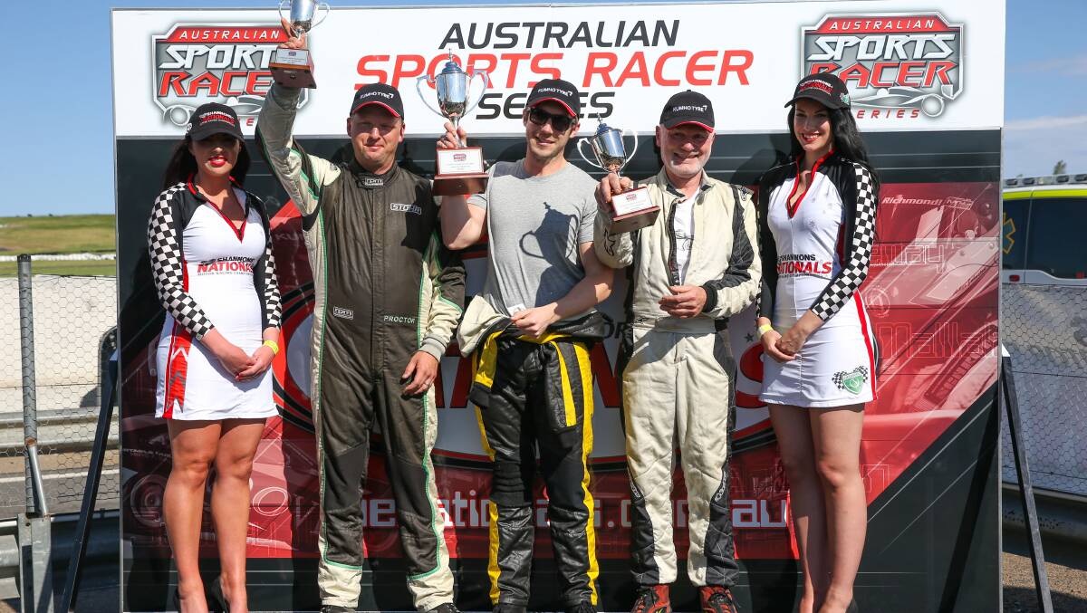 WINNER: Adam Proctor (second from left) successfully defended his Australian Sports Racer series crown on Sunday despite
finishing third. Photo: Supplied.