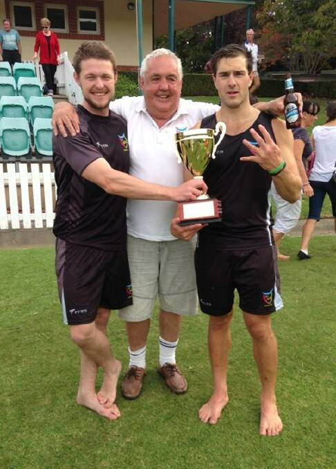 CELEBRATION: Vice captain Brad Smith, team
manager Bob Smith and skipper Mik Webber celebrate
with the premiership trophy.