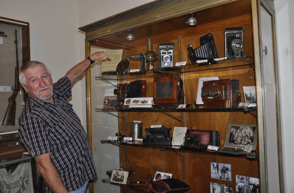 Goulburn and District Historical Society vice-president Roger Bayley shows off some of the memerobilia held at St Clair