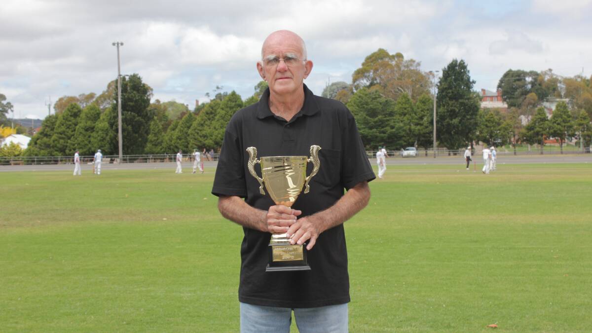 Greg McCabe, brother of the late Rod McCabe, was honoured and privileged to present the inaugural Rod McCabe Cup to the winner of the Workers Stags vs Lake George Bunyips second grade one day cricket grand final at Seiffert Oval yesterday afternoon. Photo: Chris Clarke