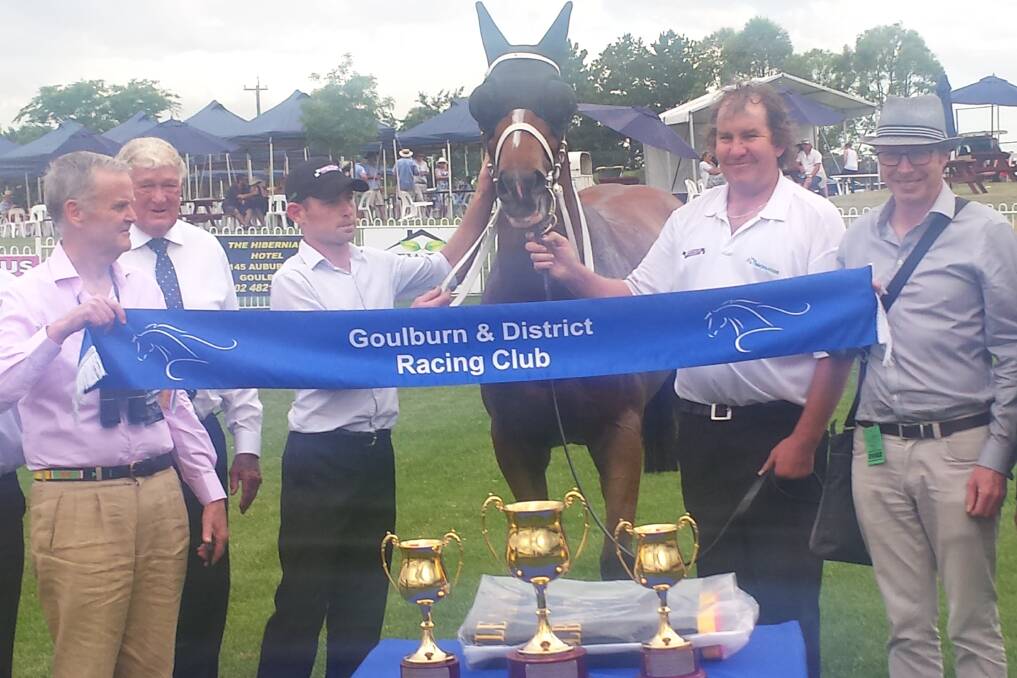 Pythagorean with representatives from trainer Chris Waller's stables and president of the Goulburn Horse Racing Club Fred Cooper, second from left.