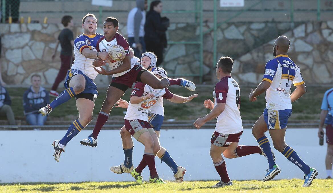 Bulldog Tim Turner and Queanbeyan player Kody Parsons go up for the ball. Photo:Jeffrey Chan.