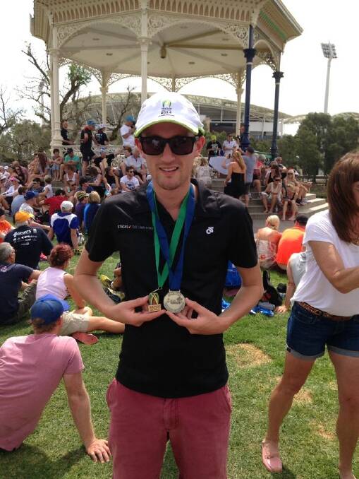 BACK AND RUNNING: Goulburnian Cameron Roberts with his first place medal in the 20-24 age group and third
place overall medal at the Australian and Oceanic Duathlon Championships in Adelaide two weeks ago.
Photo: Supplied.