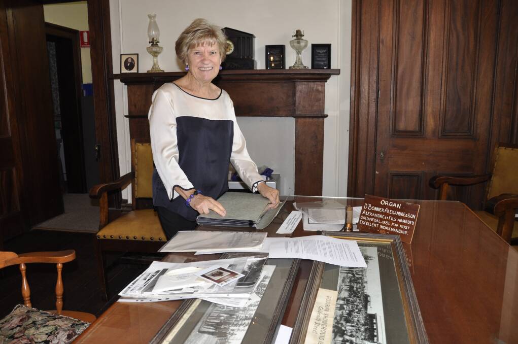 Goulburn and District Historical Society member Linda Cooper with some of the items on display