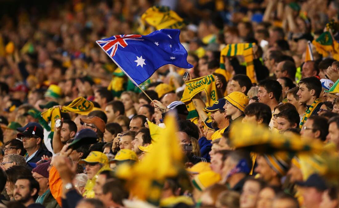 GO AUSSIES: Australians have gotten right behind not only the Socceroos, but the entire Asian Cup. Photo: Getty Images / Brendon Thorne
