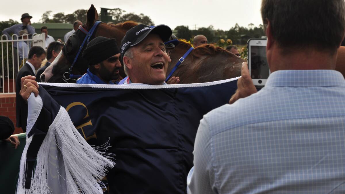 Joel Roya, an owner of Without a Shadow celebrates his win.
