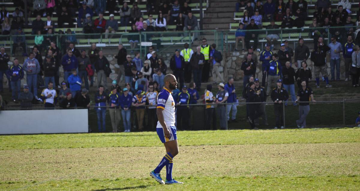 Bulldog Michael Bani stands in front of the vocal Goulburn supporters. Photo: Chris Clarke